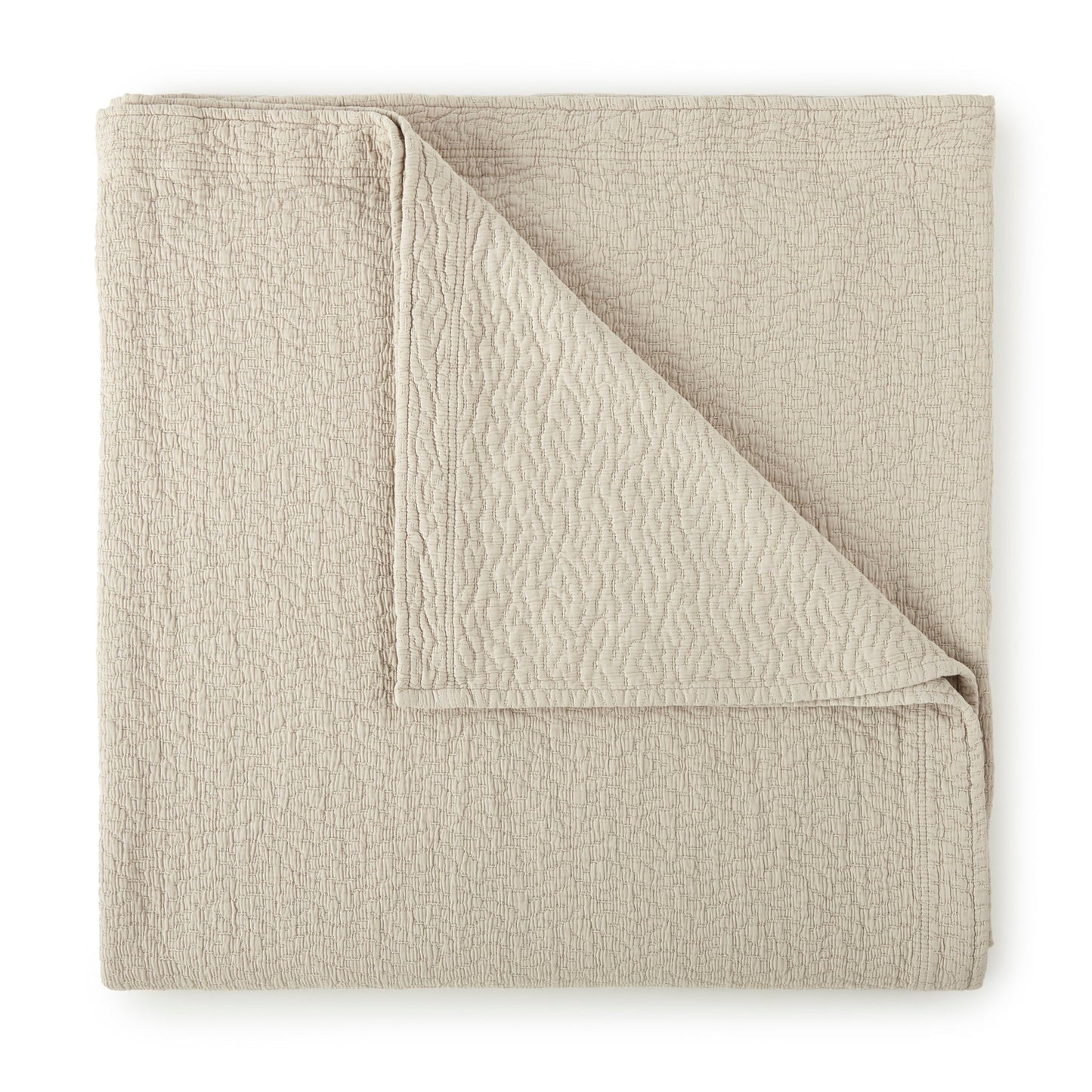 Folded Coverlet of Peacock Alley Mia Stonewashed Matelassé Bedding in Color Dune