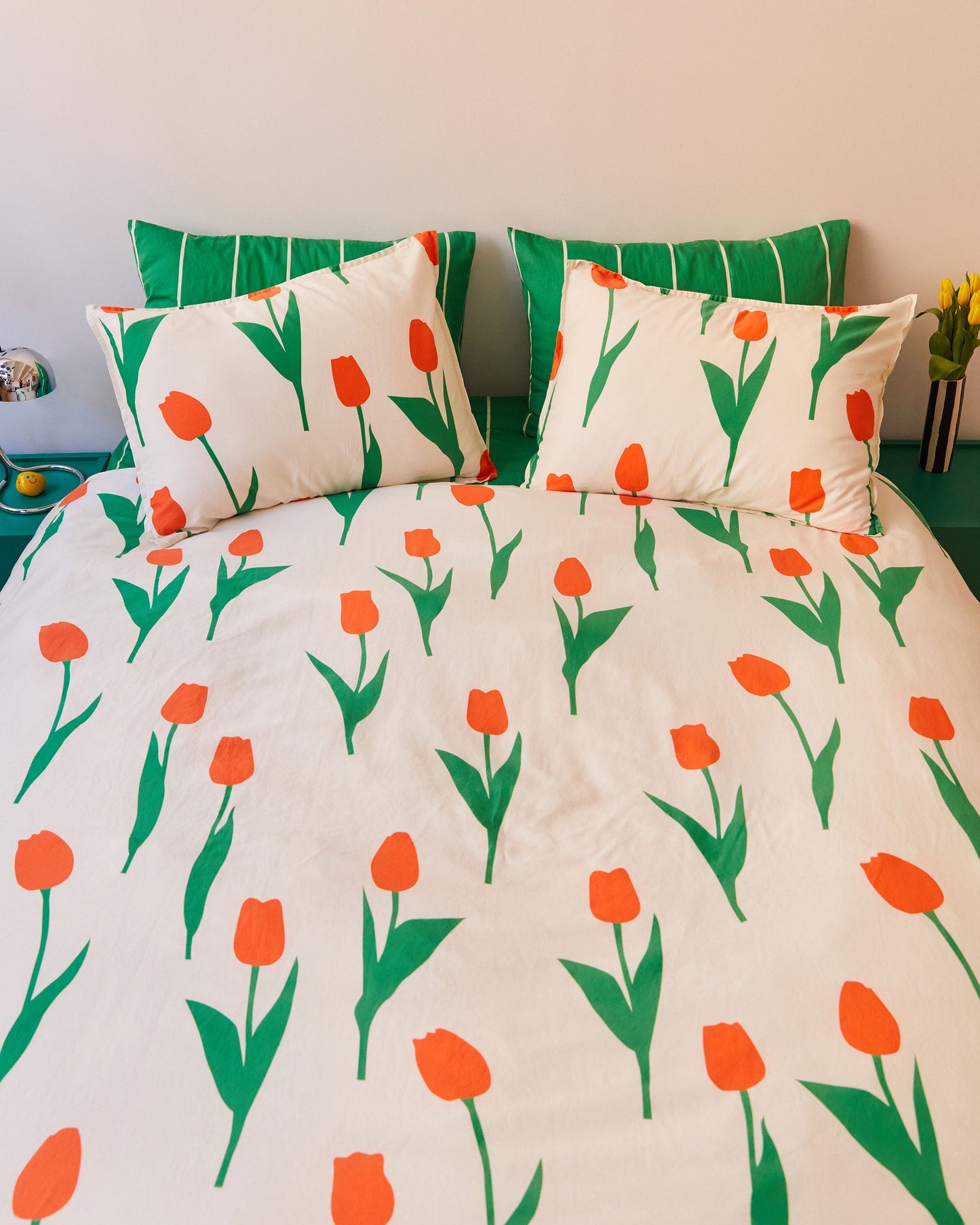 Dusen Dusen Tulip Duvet Set. Duvet cover in cream with red and green Tulip print. 100% cotton sateen, 300 thread count. Machine wash cold and tumble dry. Made in Portugal. Our cotton sateen is smooth and cool to the touch and features a slightly lustrous finish.; What could be better than sleeping in a tulip garden? Umm, how about WORLD PEACE?! But the tulips are pretty amazing too.